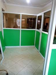 A green aluminum and glass partition in Juba, South Sudan