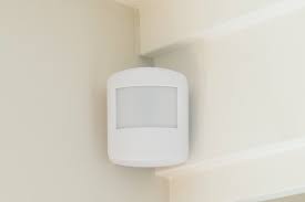 A motion detector on the wall