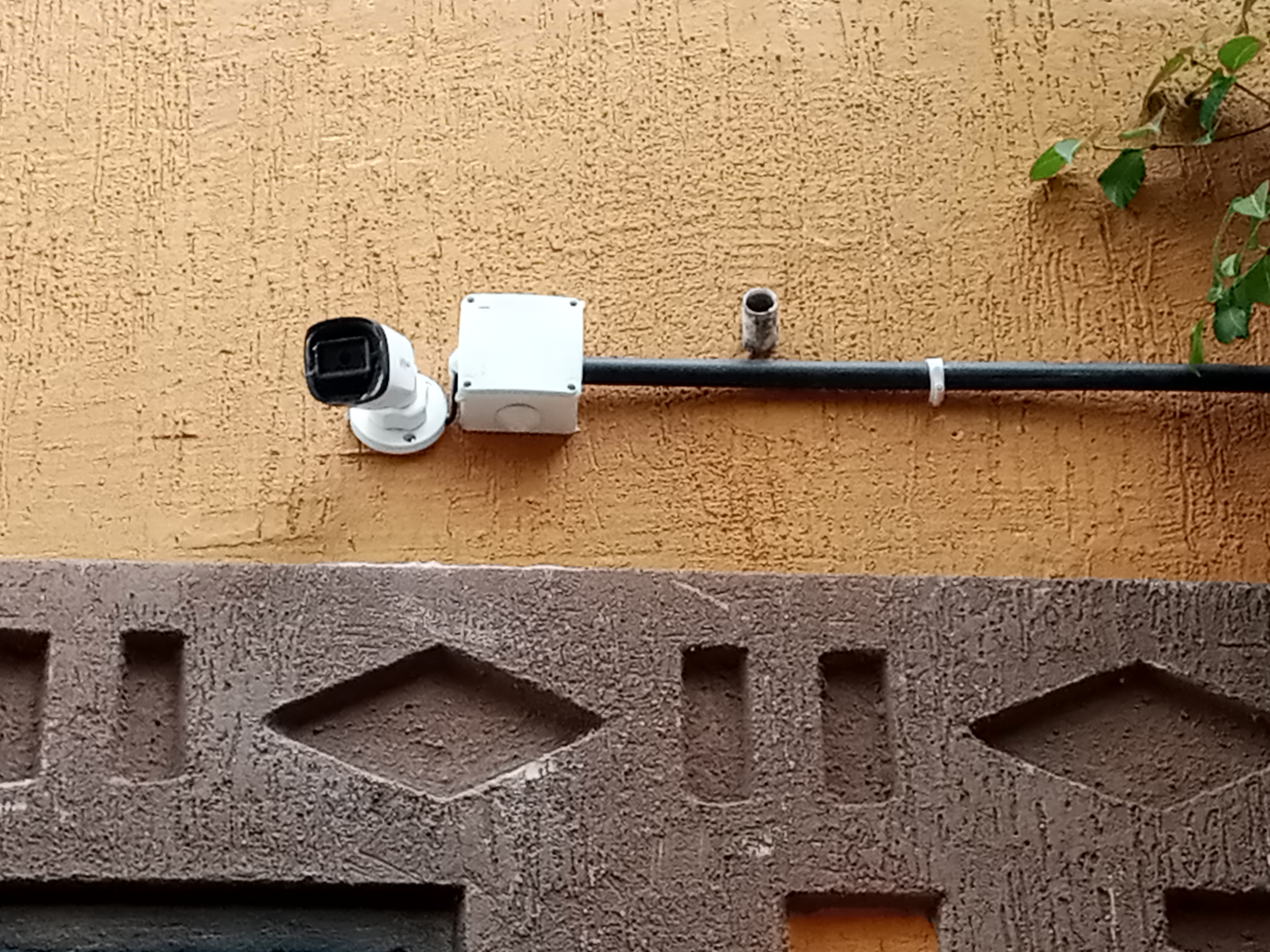 A dahua bullet camera mounted on the wall covering the compound of a home in Juba, South Sudan.