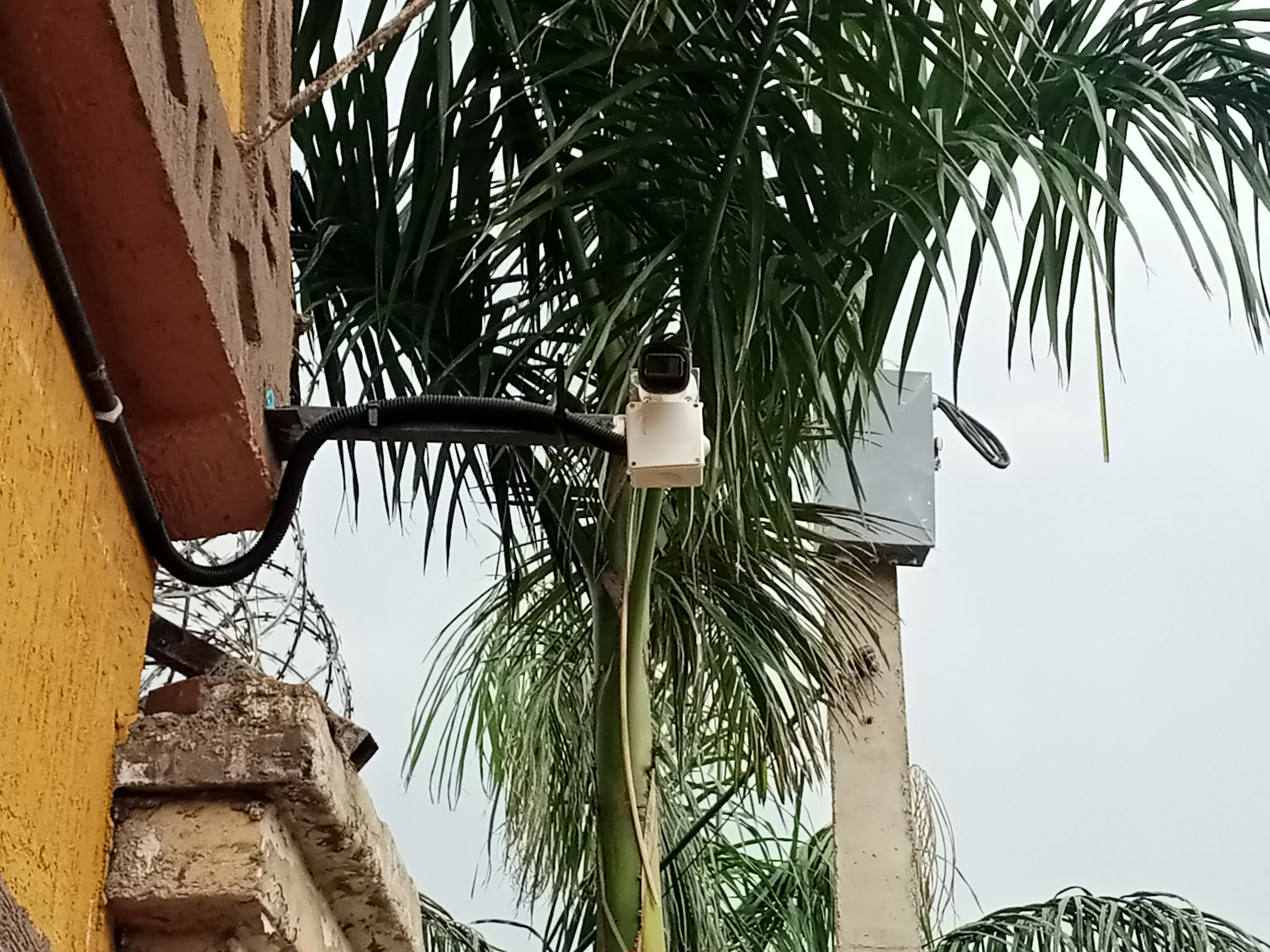 A dahua bullet CCTV camera extended from the side of a home in Juba, South Sudan.