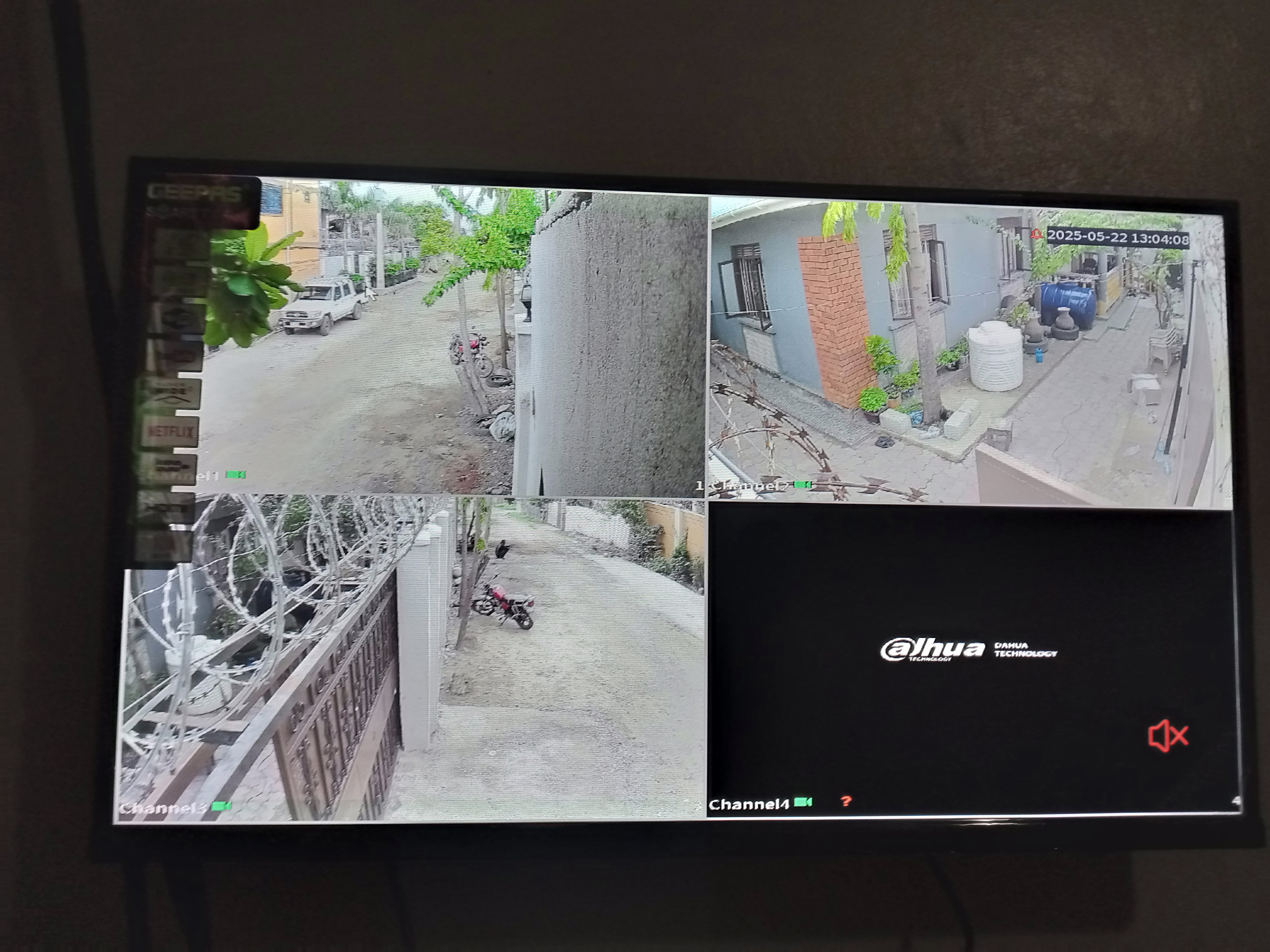 A TV screen with 3 live view from CCTV cameras in a residential building in Juba, South Sudan.