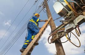  An electrician climbing up a pole in  Juba South Sudan