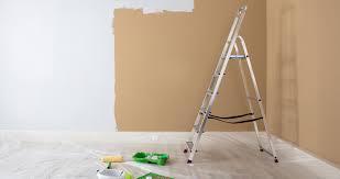 A partially painted wall and a ladder in Juba, South Sudan