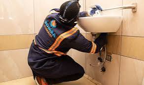 A plumber fixing water sink in Juba, South Sudan