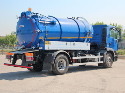  the back and side view of a blue sewage truck in Juba, South Sudan