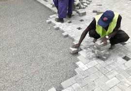 Technicians installing pavers in Juba, South Sudan