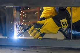 Welder in action with sparks in Juba, South Sudan